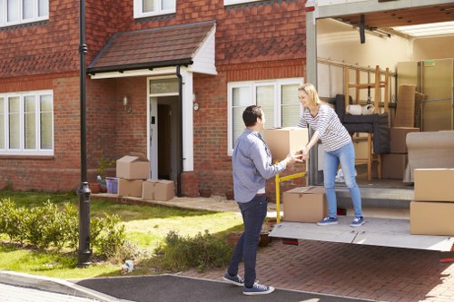 Professional movers handling boxes and furniture in Downe