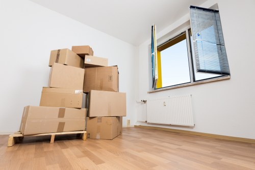 Packed office furniture and equipment ready for a local business move