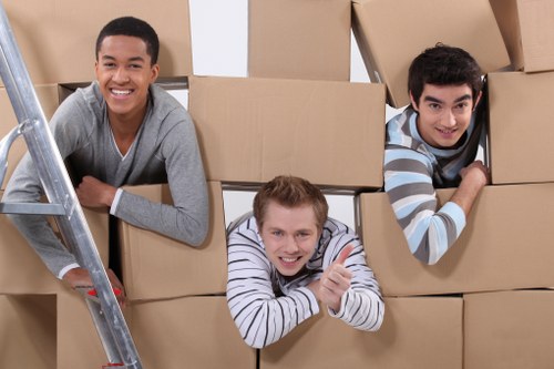 Careful furniture handling on a narrow Downe lane during a house move