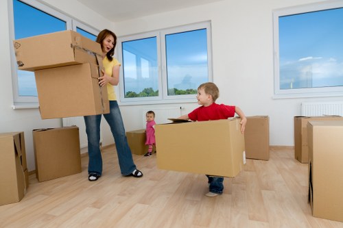 Professional movers handling household furniture in Downe