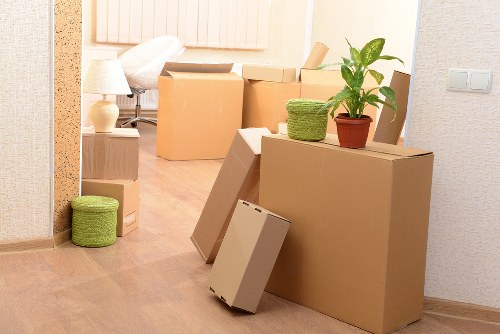Removal professionals loading commercial items for transport