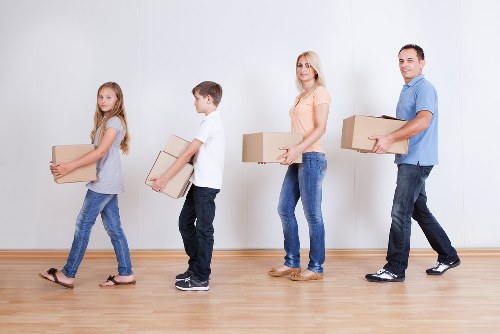 Professional team handling office furniture and equipment for a Downe move