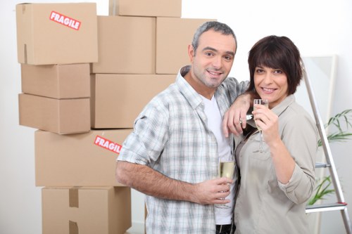 Packed boxes and furniture ready for loading into a removal van